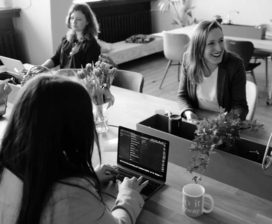 Smiling Women in A Modern Office