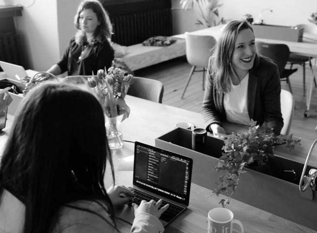 Smiling Women in A Modern Office